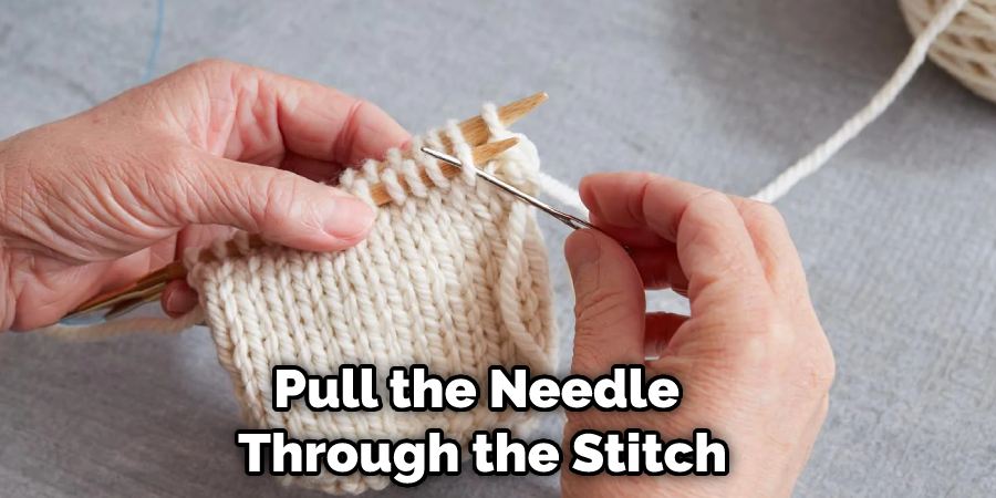 Pull the Needle Through the Stitch
