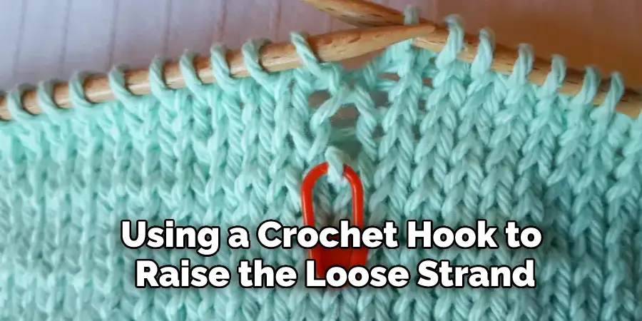Using a Crochet Hook to Raise the Loose Strand