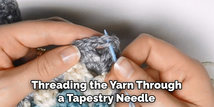 Threading the Yarn Through a Tapestry Needle