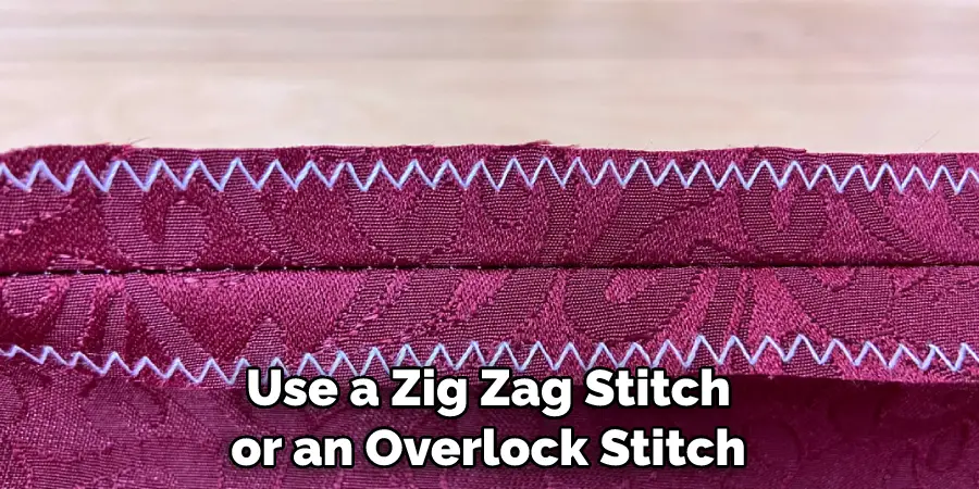 Use a Zig Zag Stitch or an Overlock Stitch