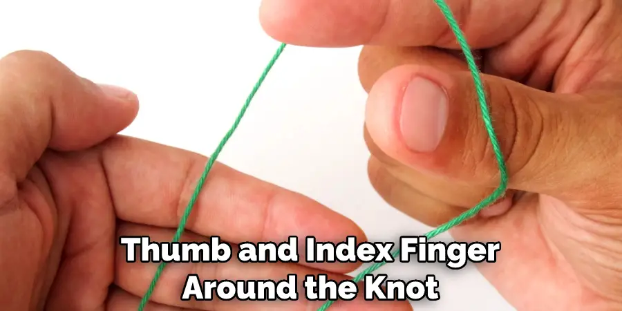Thumb and Index Finger Around the Knot