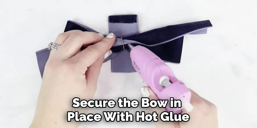 Secure the Bow in Place With Hot Glue