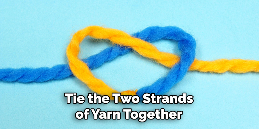 Tie the Two Strands of Yarn Together