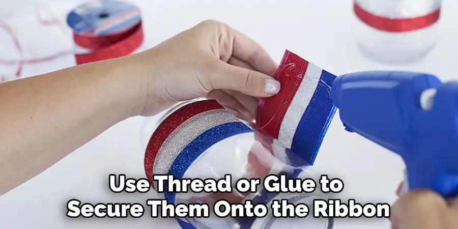 Use Thread or Glue to Secure Them Onto the Ribbon