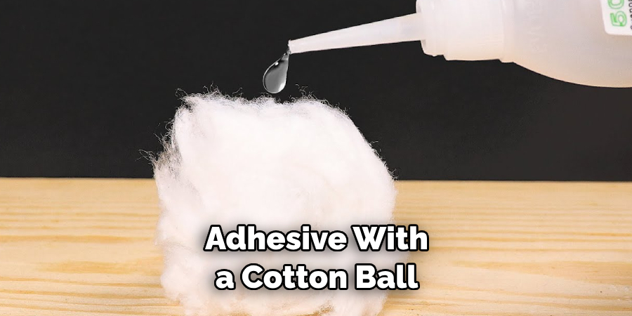 Adhesive With a Cotton Ball