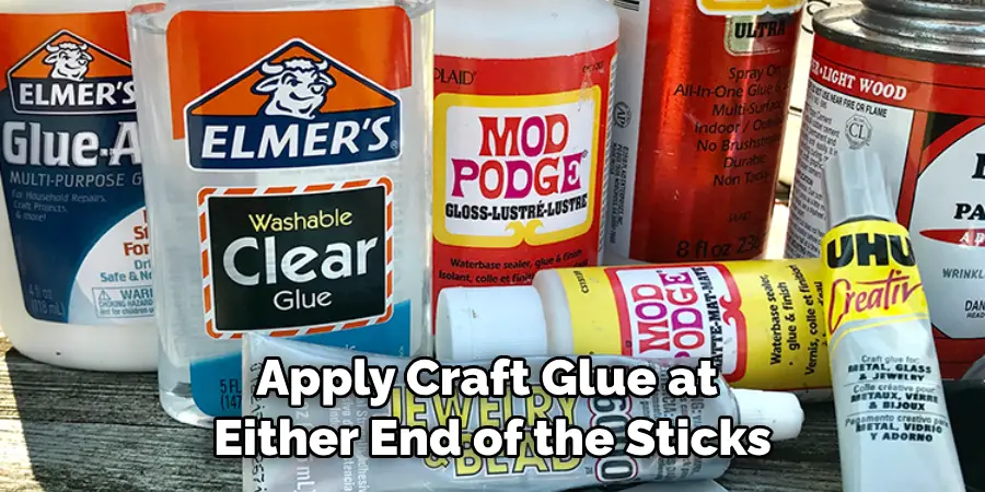 Apply Craft Glue at Either End of the Sticks