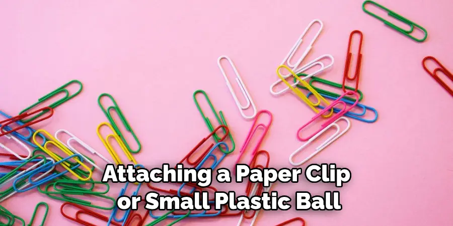 Attaching a Paper Clip or Small Plastic Ball