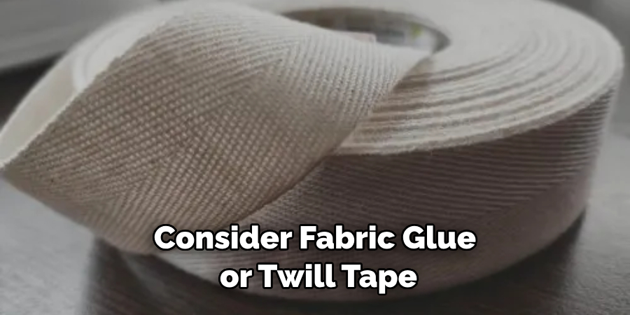 Consider Fabric Glue or Twill Tape