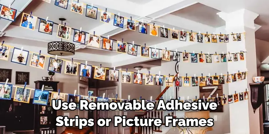Use Removable Adhesive Strips or Picture Frames