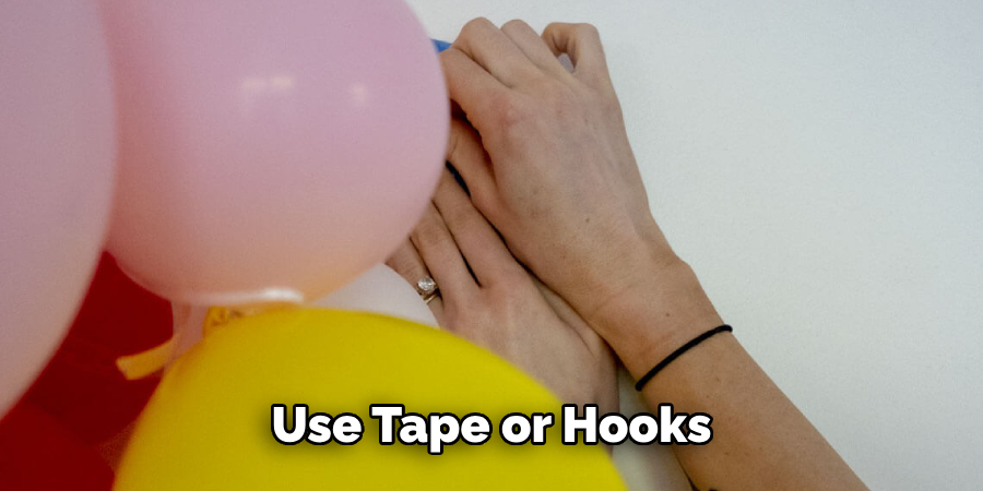 Use Tape or Hooks