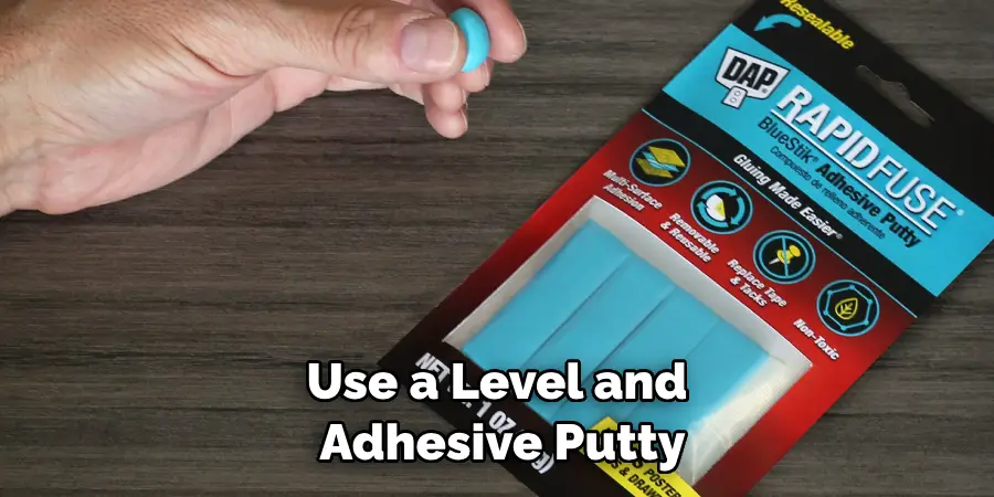 Use a Level and Adhesive Putty