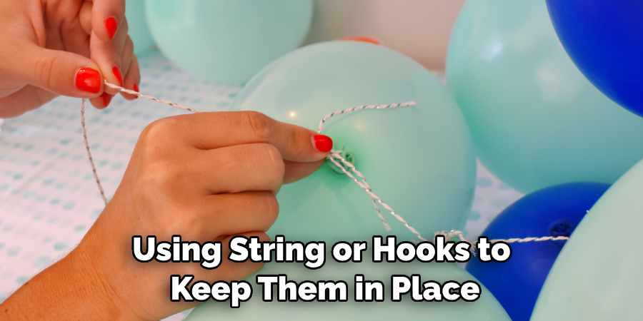 Using String or Hooks to Keep Them in Place