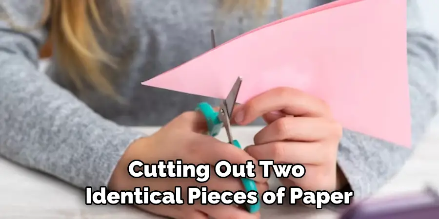 Cutting Out Two Identical Pieces of Paper