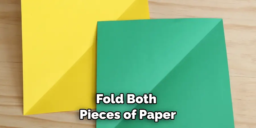 Fold both pieces of paper