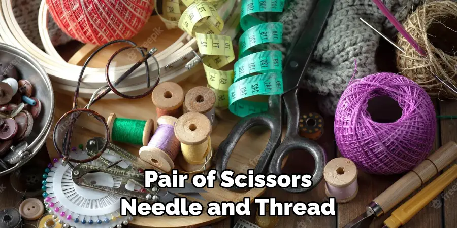 Pair of Scissors Needle and Thread