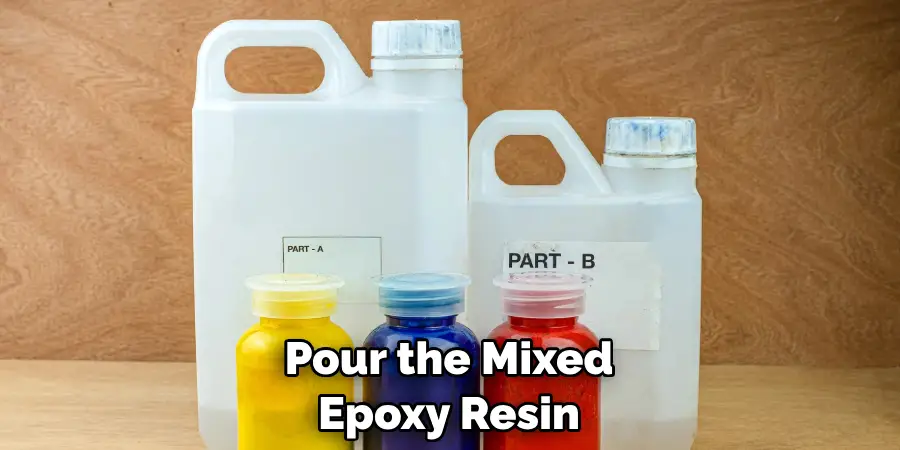 Pour the Mixed Epoxy Resin