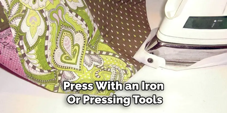 Press With an Iron or Pressing Tools