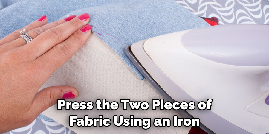 Press the Two Pieces of Fabric Using an Iron