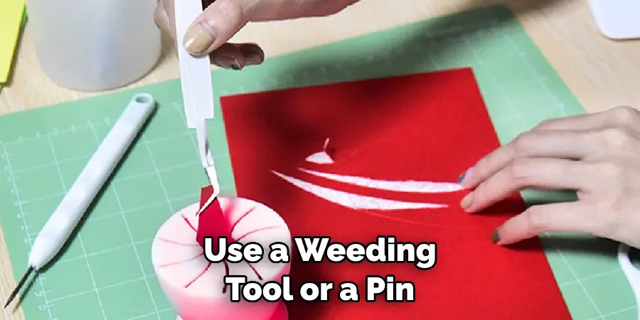 Use a Weeding Tool or a Pin