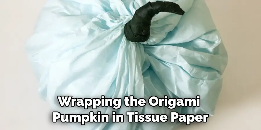 Wrapping the Origami Pumpkin in Tissue Paper