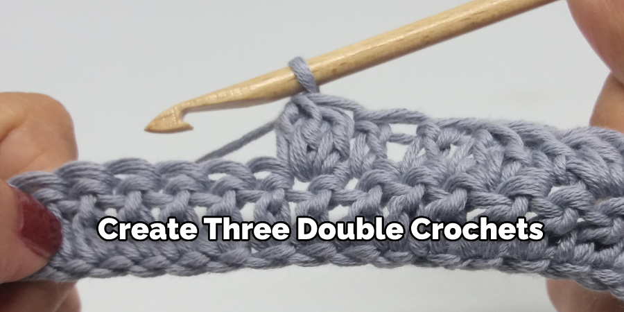 create three double crochets