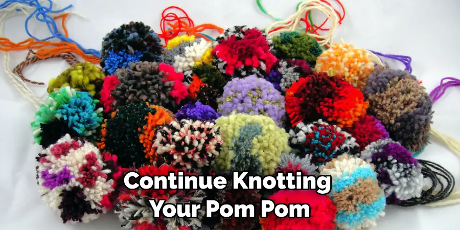 Continue Knotting Your Pom Pom