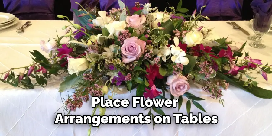 Place Flower Arrangements on Tables