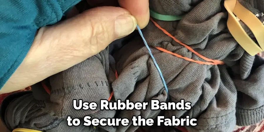 Use Rubber Bands to Secure the Fabric