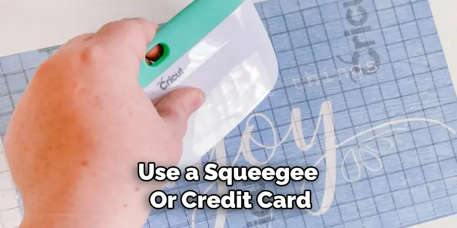Use a Squeegee or Credit Card