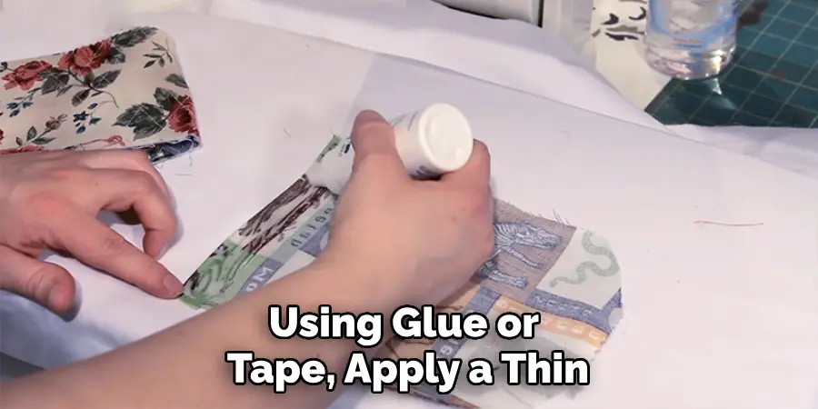 Using Glue or Tape, Apply a Thin