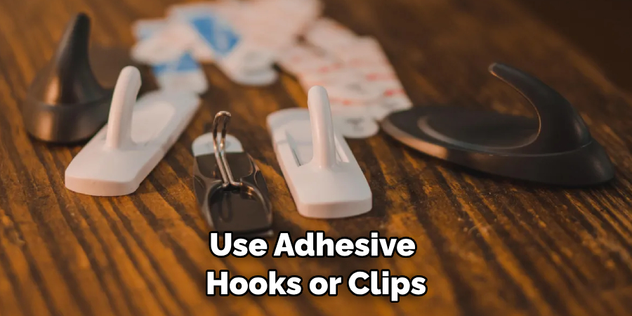 Use Adhesive Hooks or Clips