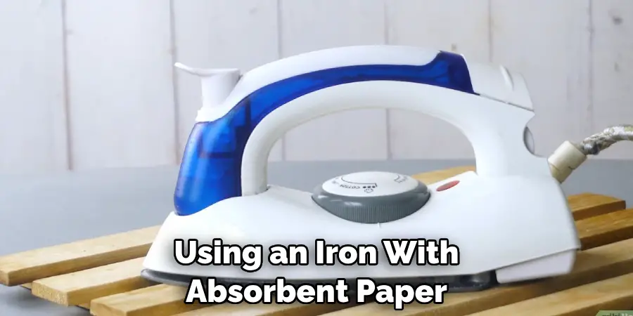 Using an Iron With Absorbent Paper