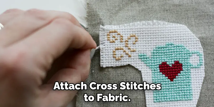 Attach Cross Stitches to Fabric. 