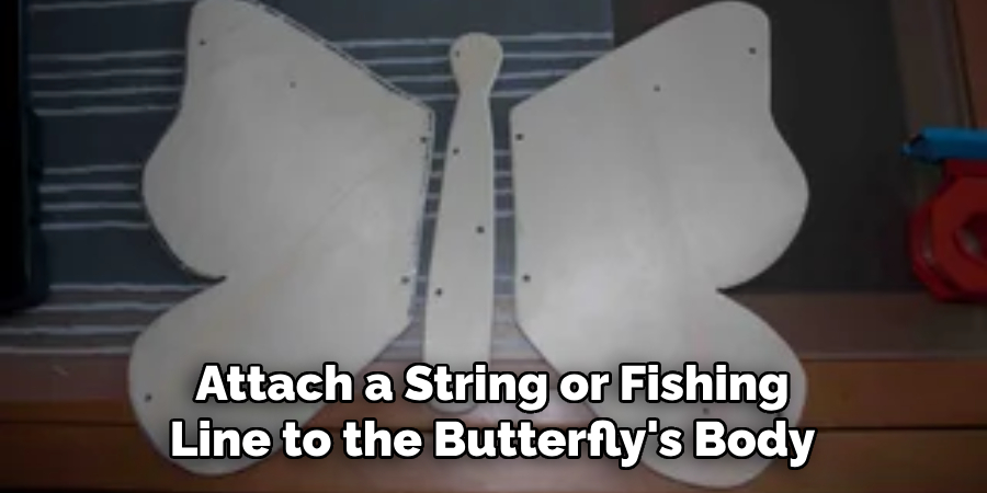 Attach a String or Fishing Line to the Butterfly's Body