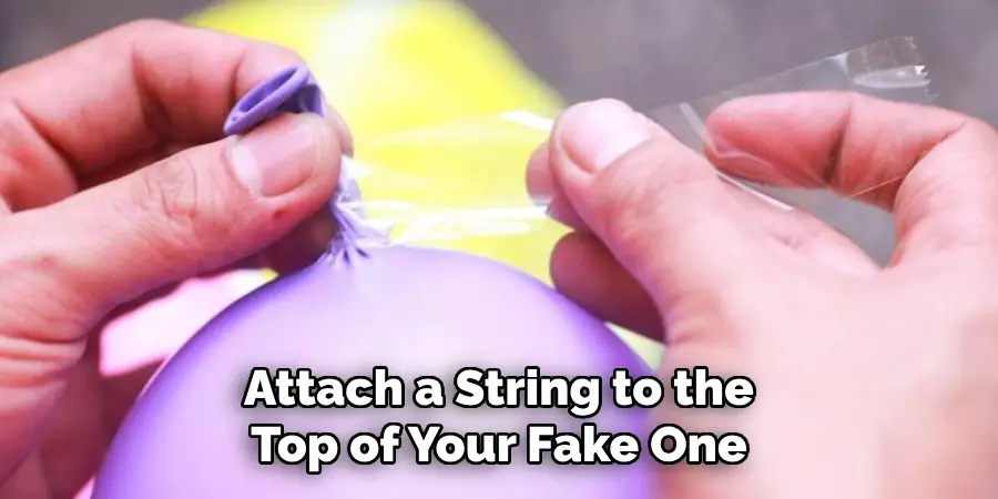 Attach a String to the
Top of Your Fake One