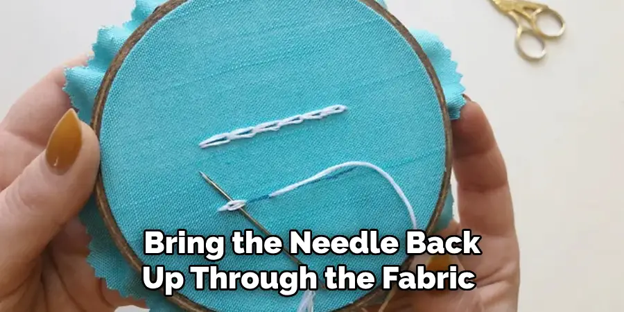 Bring the Needle Back Up Through the Fabric 