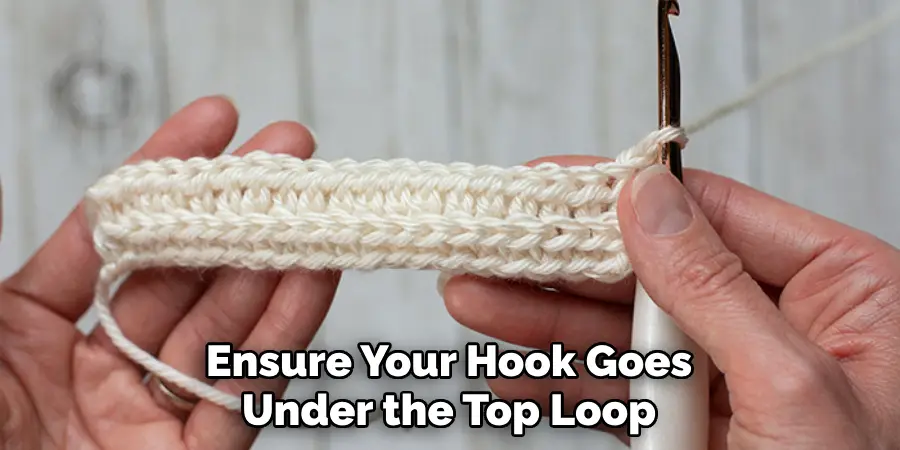 Ensure Your Hook Goes Under the Top Loop
