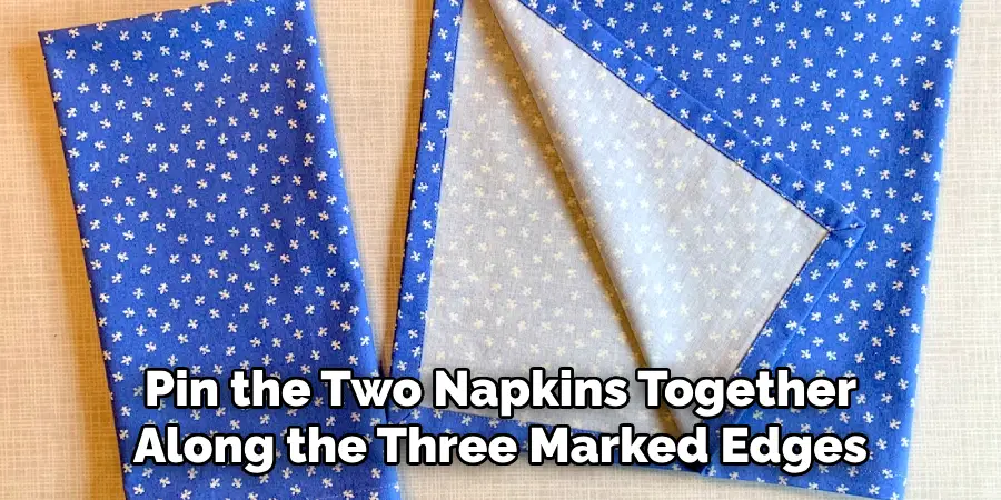 Pin the Two Napkins Together Along the Three Marked Edges 