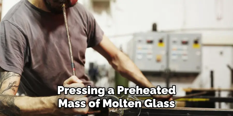 Pressing a Preheated Mass of Molten Glass