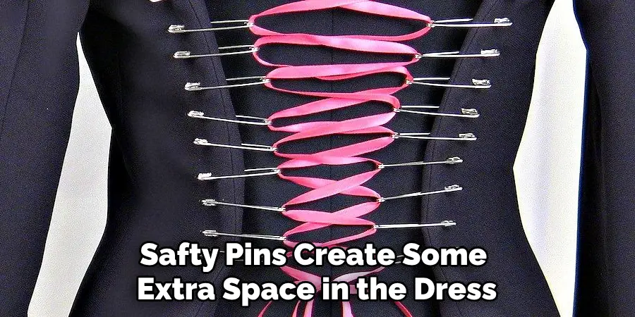 Safty Pins Create Some Extra Space in the Dress