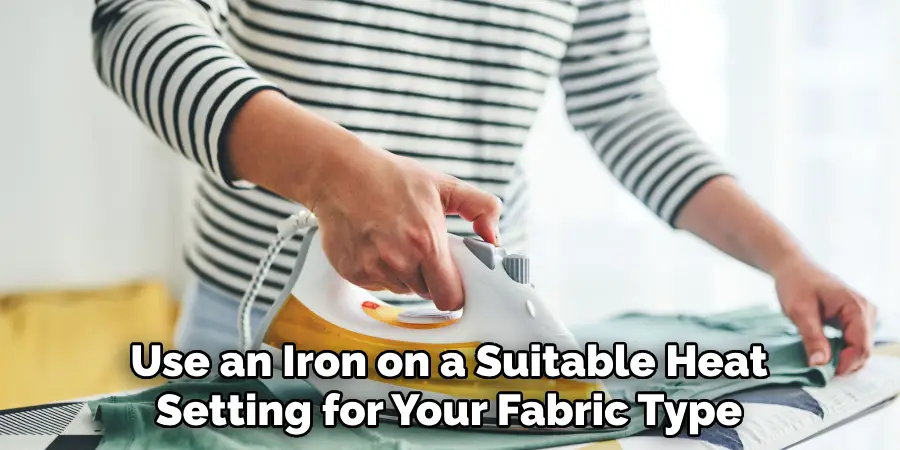 Use an Iron on a Suitable Heat Setting for Your Fabric Type