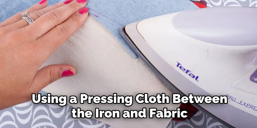Using a Pressing Cloth Between the Iron and Fabric