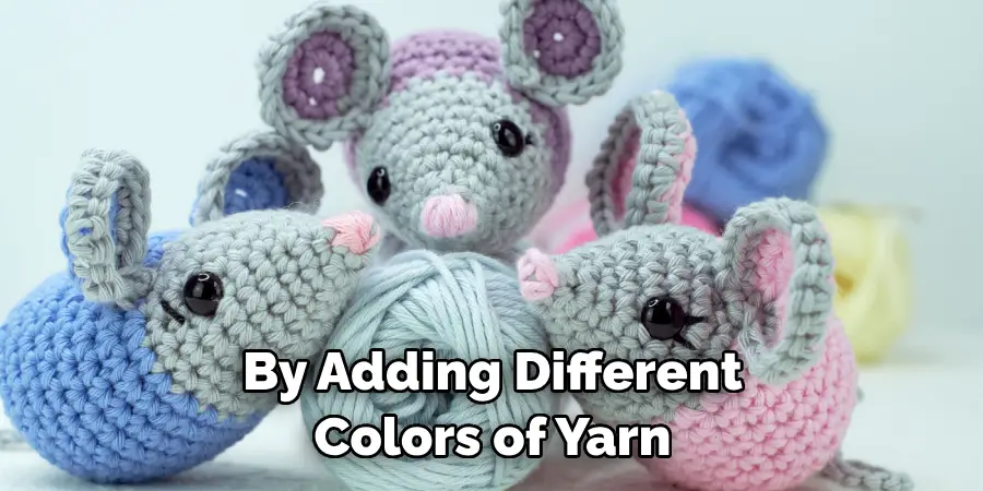 By Adding Different Colors of Yarn