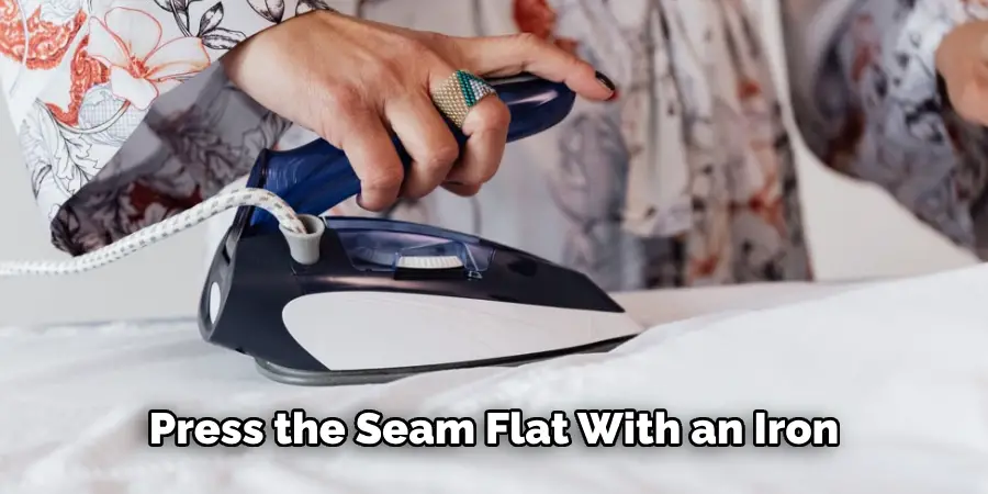  Press the Seam Flat With an Iron