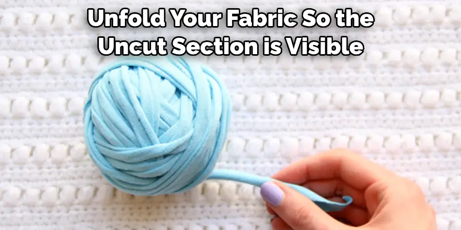 Unfold Your Fabric So the Uncut Section is Visible