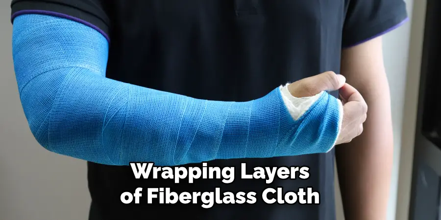 Wrapping Layers of Fiberglass Cloth