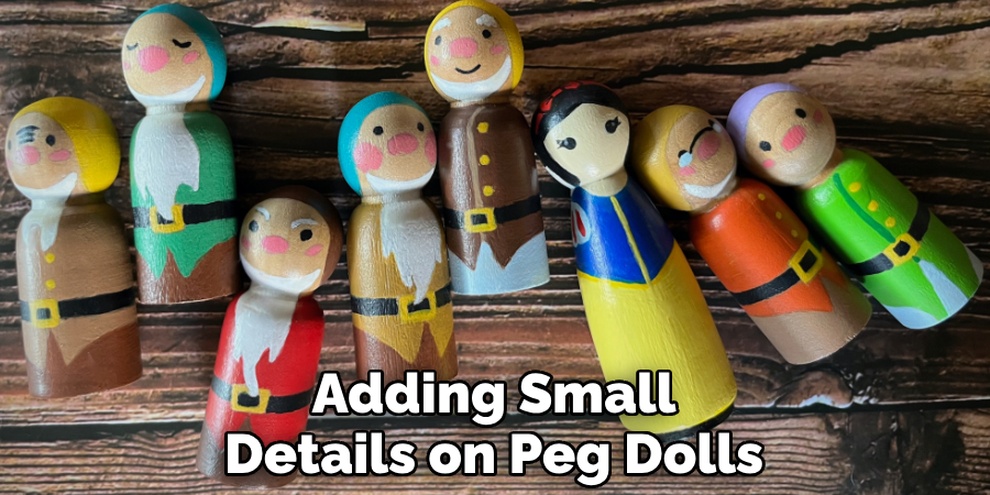 Adding Small Details on Peg Dolls