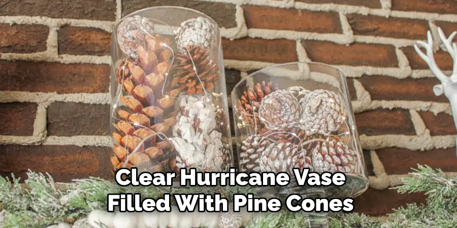 Clear Hurricane Vase Filled With Pine Cones