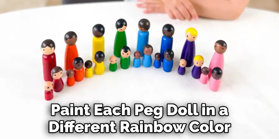 Paint Each Peg Doll in a Different Rainbow Color