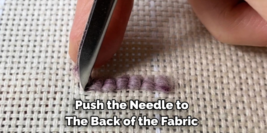 Push the Needle to The Back of the Fabric